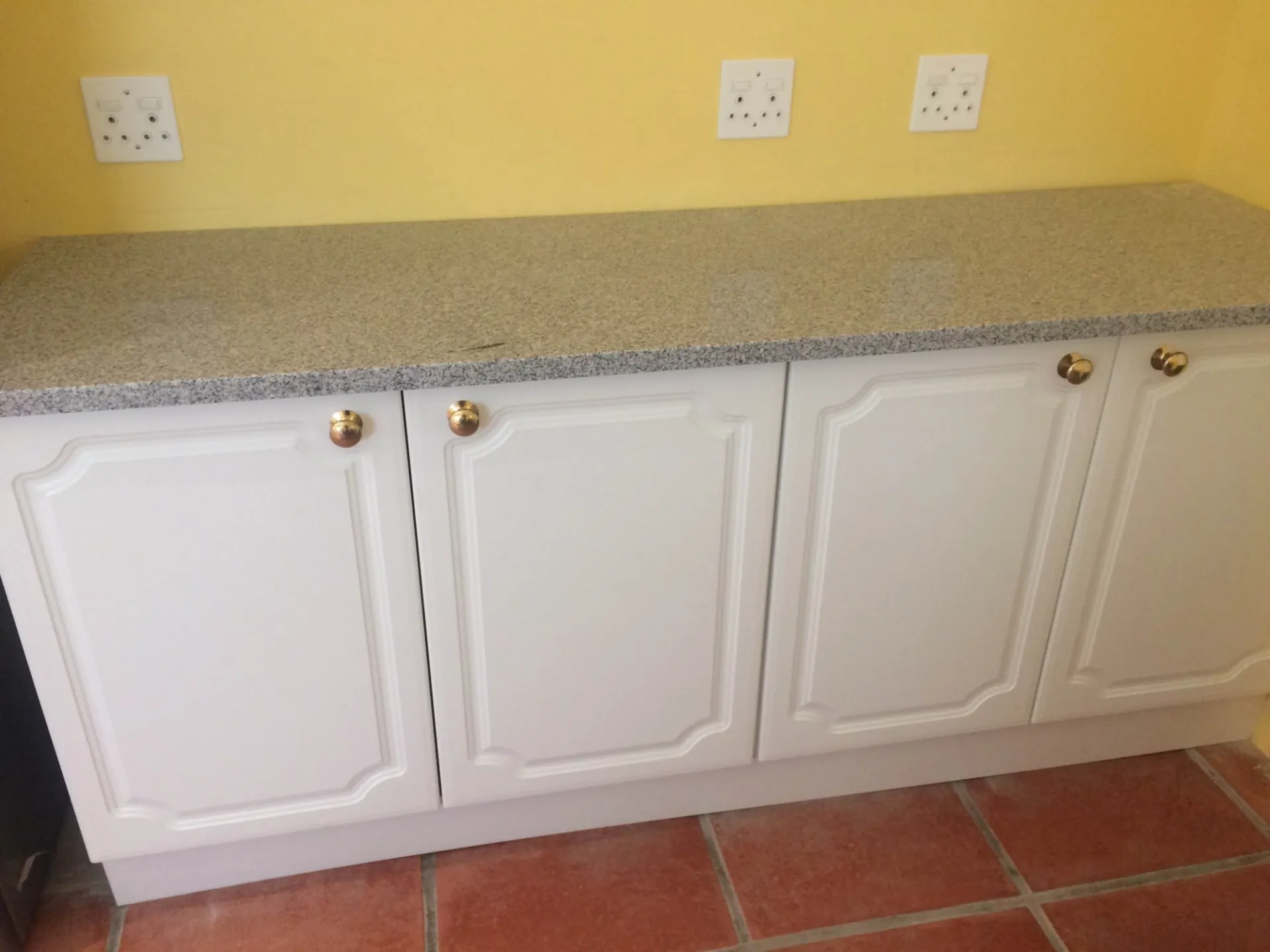 A kitchen mid-renovation with new cabinetry installed.
