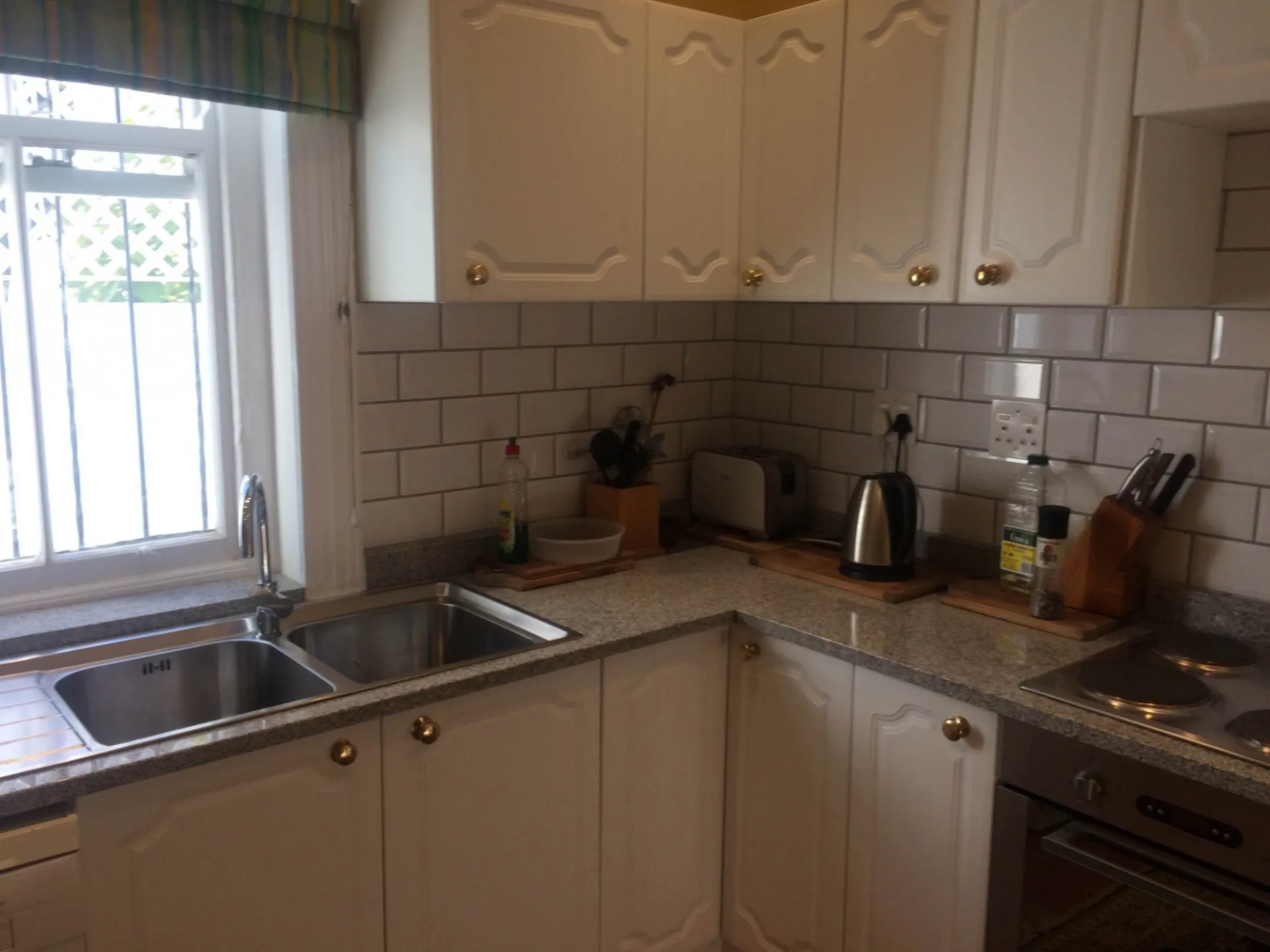 A completed kitchen with a corner sink and new plumbing.