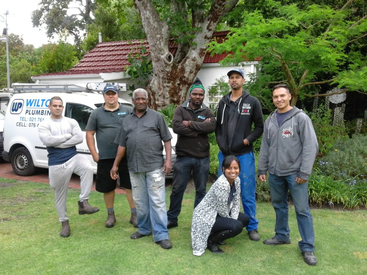 The Wilton Plumbing team lined up in front of their vans.